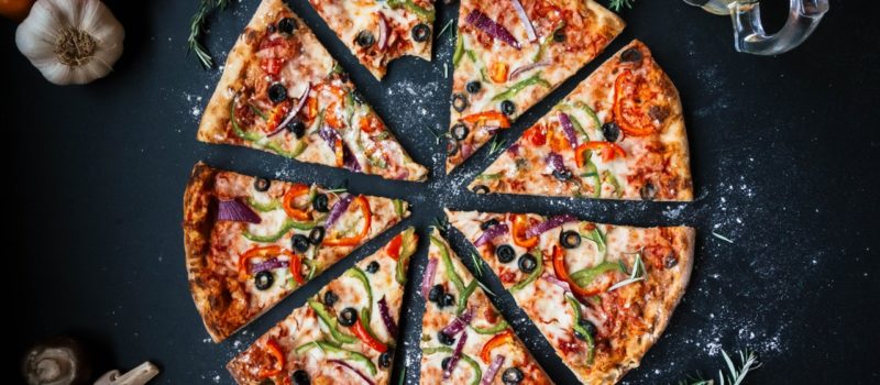 slices of pizza and a glass of beer